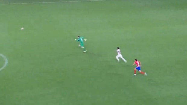 Brahim Diaz pictured (center) moments before scoring a bizarre goal past keeper Jan Oblak (left) during Real Madrid's 5-3 win over Atletico Madrid in the semi-finals of the 2023/24 Supercopa de Espana